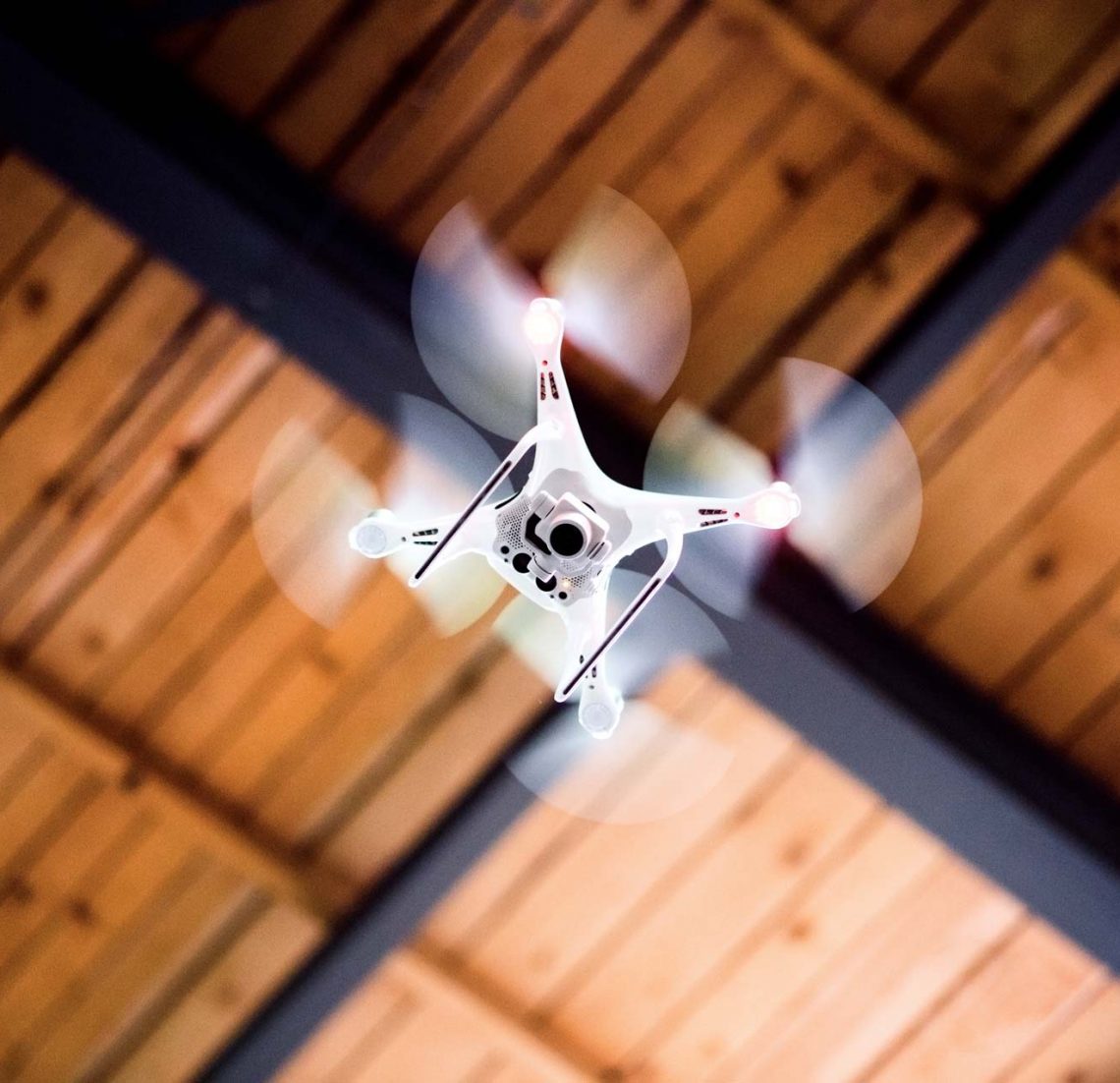 White Drone Flying Inside The Building Pbw66A6